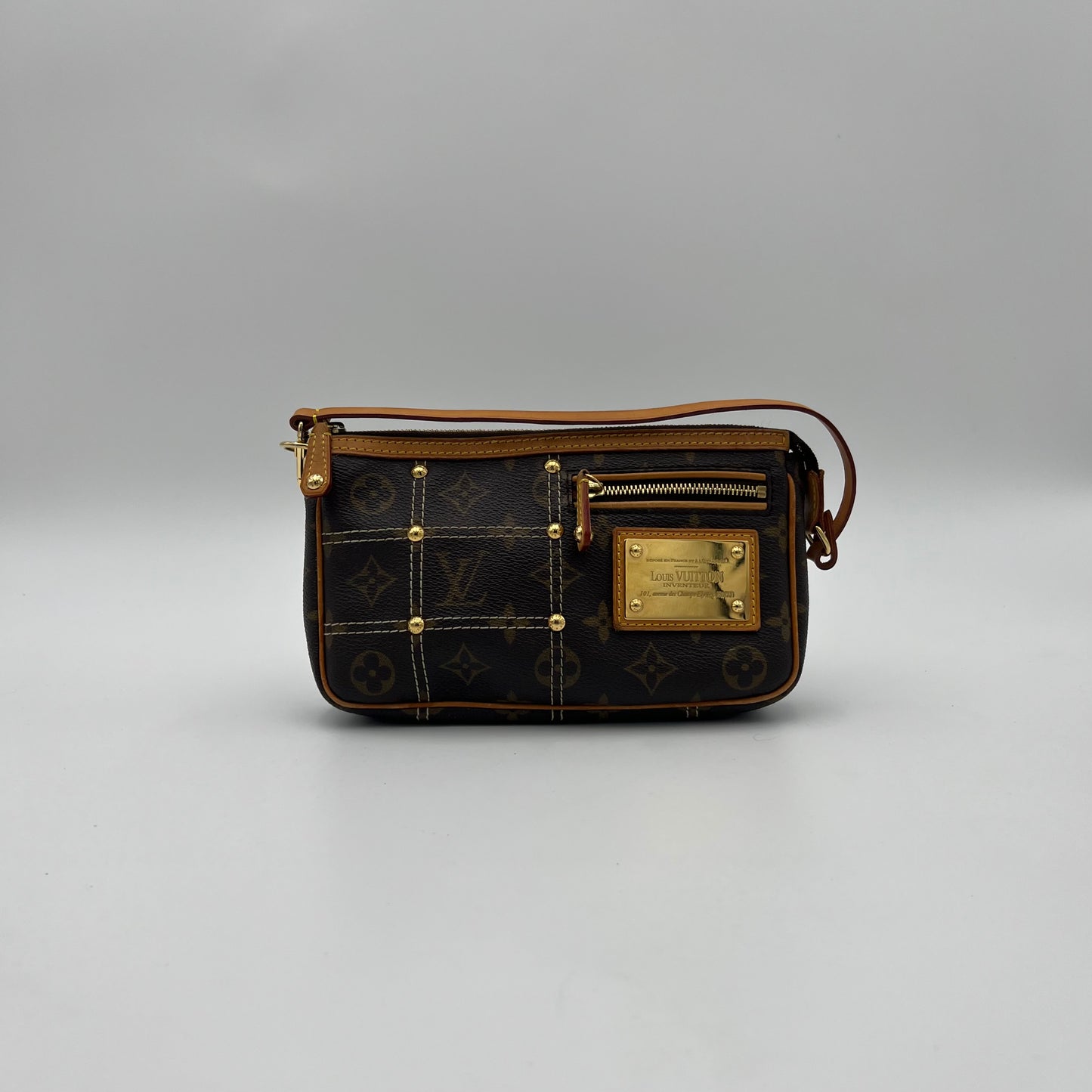 LV Limited Edition Monogram Canvas Riveting Pochette designed by Marc Jacobs