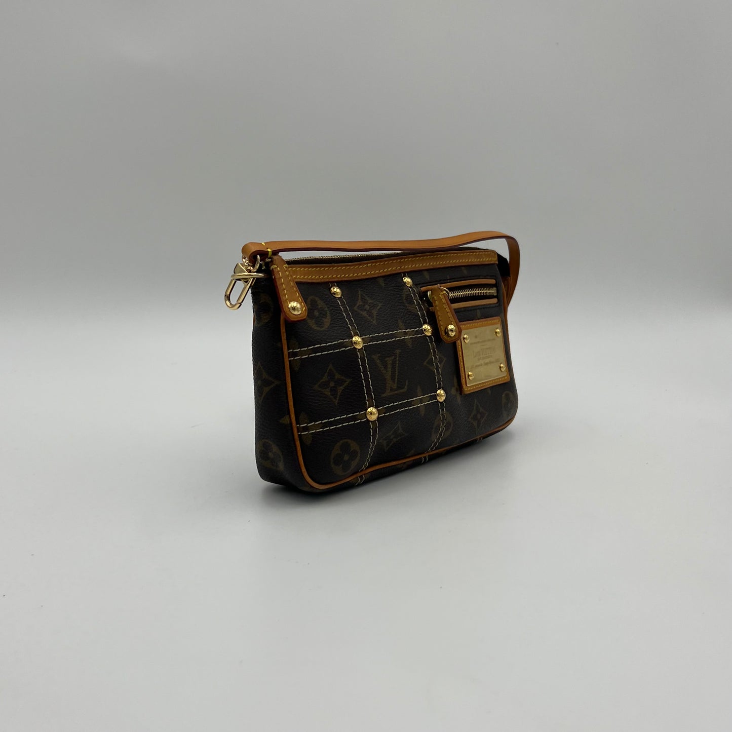LV Limited Edition Monogram Canvas Riveting Pochette designed by Marc Jacobs