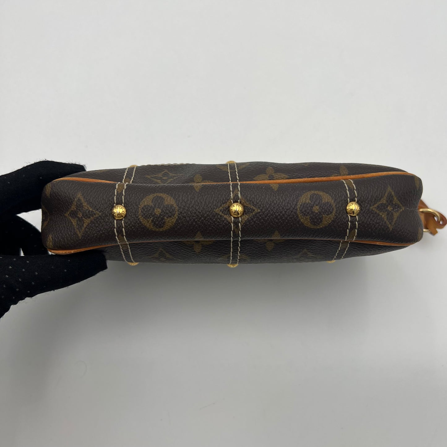 LV Limited Edition Monogram Canvas Riveting Pochette designed by Marc Jacobs