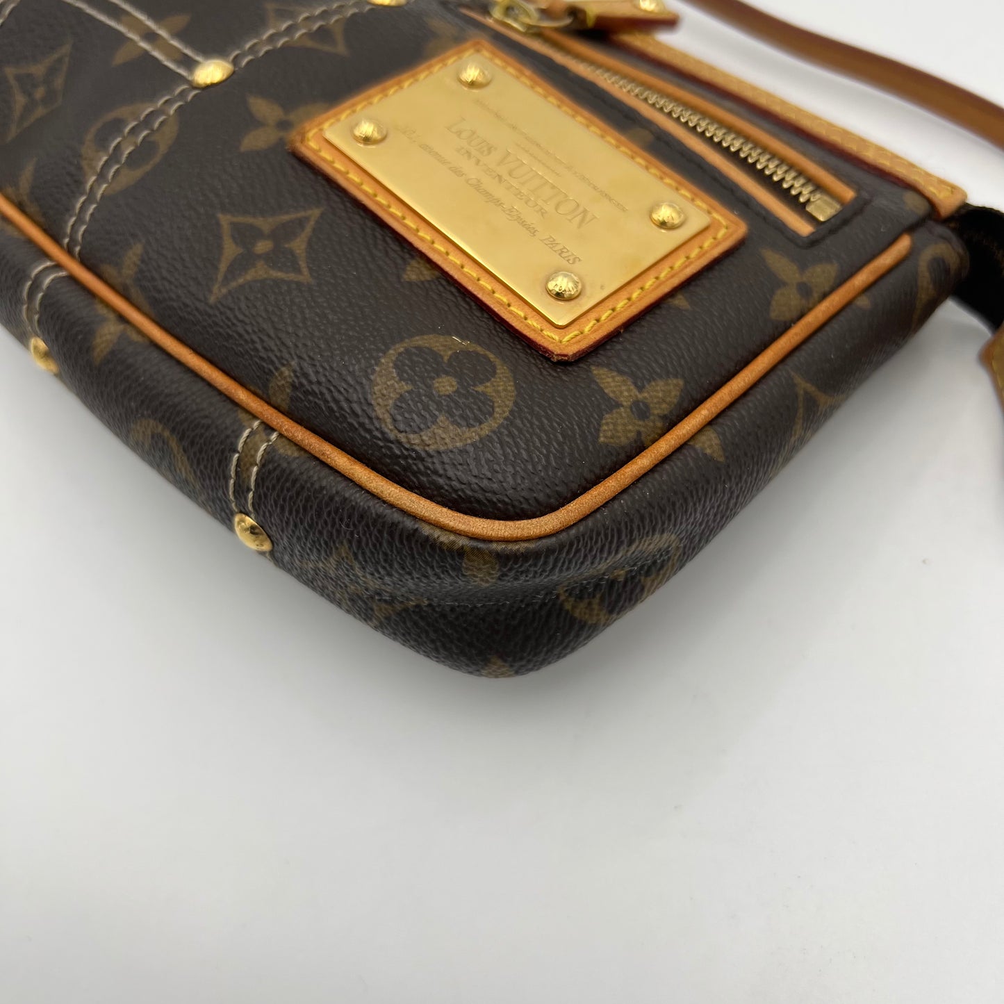 LV Limited Edition Monogram Canvas Riveting Pochette designed by Marc Jacobs