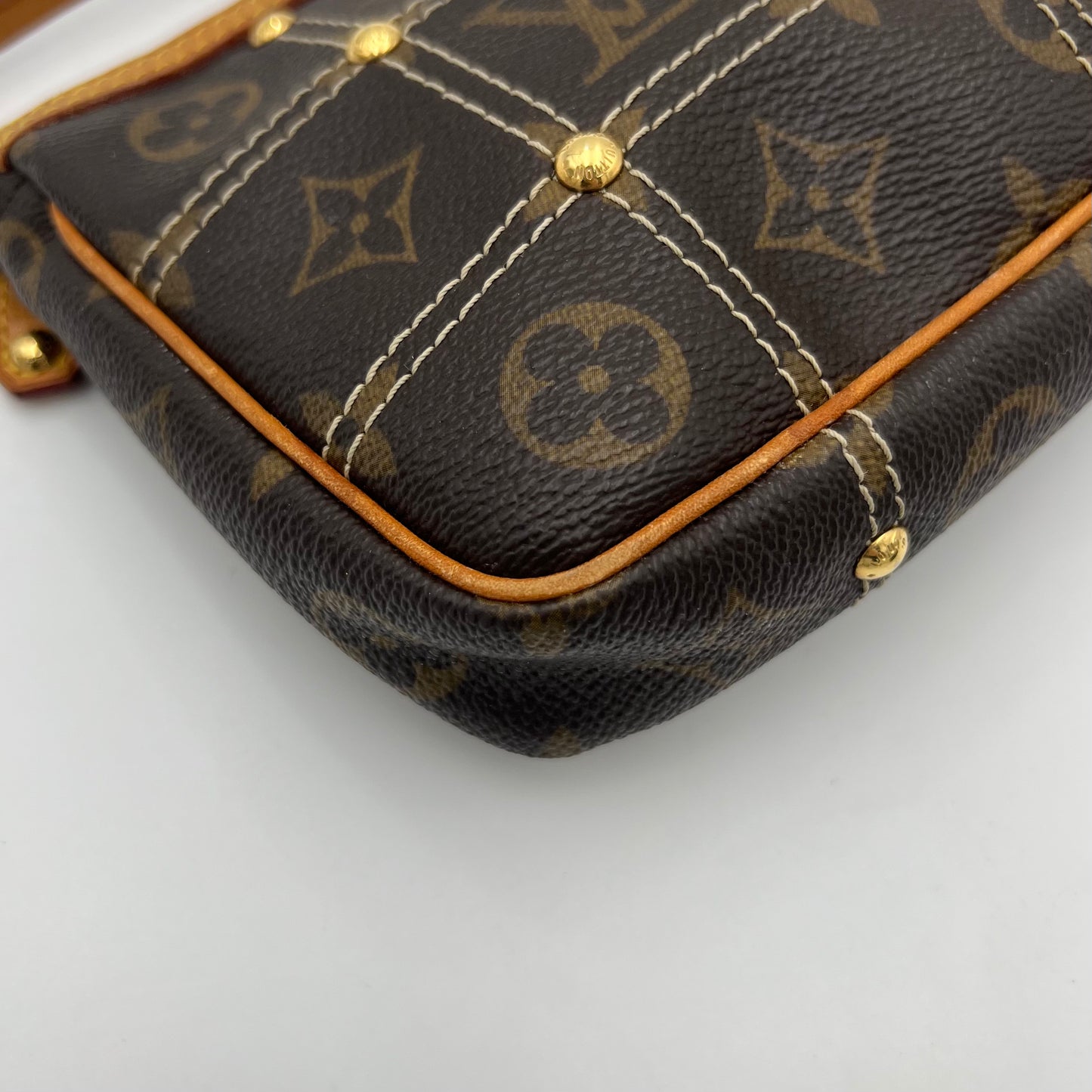 LV Limited Edition Monogram Canvas Riveting Pochette designed by Marc Jacobs